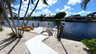 Privater Bootssteg mit Sitzmöbeln und Kanus direkt am Kanal - ideal für Wassersportfans - Traum-Urlaub-Florida