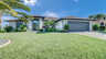 Villa Leykia Cape Coral Ferienhaus mit großer Rasenfläche, Palmen und breiter Einfahrt - Traum-Urlaub-Florida