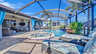 Überdachte Terrasse mit gemütlicher Lounge, Esstisch und Blick auf den Pool mit Whirlpool. - Traum-Urlaub-Florida
