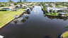 Weitläufiger Kanal mit Palmen am Ufer und direkter Verbindung zum Golf. Ruhe und Sonne pur in Cape Coral. - Traum-Urlaub-Florida