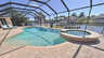 Großer Pool mit Whirlpool auf der Sonnenterrasse im Screened Patio mit Blick auf den Kanal. - Traum-Urlaub-Florida
