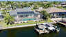 Luftaufnahme der Villa Preziosa mit Pool, Screened Patio, Garten und privatem Bootsanleger direkt am Kanal. - Traum-Urlaub-Florida