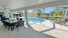 Offener Lanai-Bereich im Screen mit Esstisch und Blick über den Pool - Traum-Urlaub-Florida