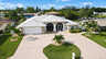 Ferienhaus Villa Almare in Cape Coral mit weißem Metalldach und kreisförmiger Einfahrt - Traum-Urlaub-Florida