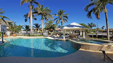 Villa Caladore Ferienhaus in Fort Myers mit geschwungenem Pool, Whirlpool und Pavillon am Kanal - Traum Urlaub Florida 