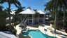 Zweistöckiges Haus mit weißem Metalldach, geschwungenem Pool, Whirlpool und Außentreppen - Traum-Urlaub-Florida