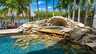 Zum Pool gehört eine malerische Grotte - Traum-Urlaub-Florida