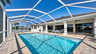 Zum Poolbereich gehören eine überdachte Terrasse und ein Sonnendeck - Traum-Urlaub-Florida
